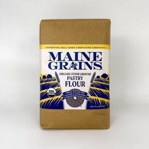 Brown bag of pastry flour over white background