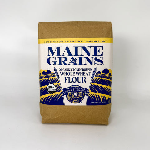 Brown bag of whole wheat flour over white background