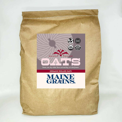 A 20# bulk bag of rolled oats in a kraft paper bag.