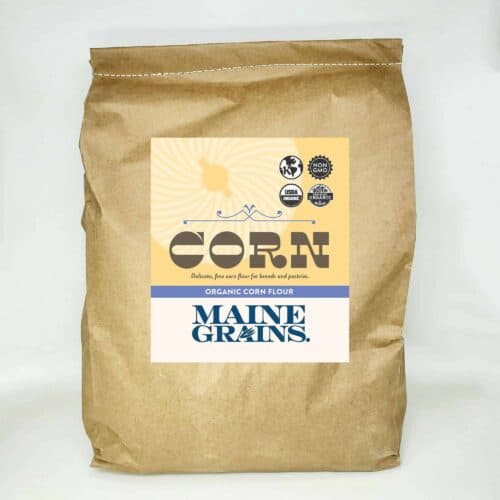 A 25# bulk bag of corn flour in a kraft paper bag.