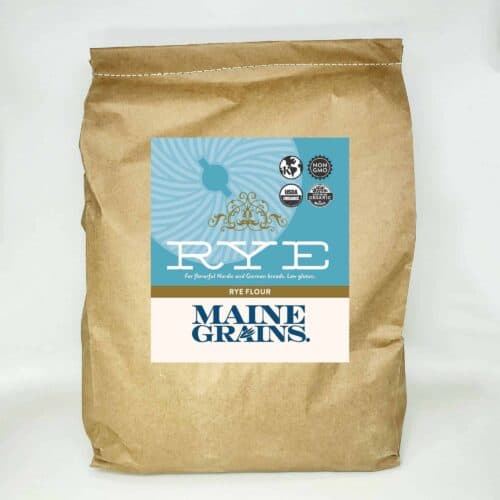 A 25# bulk bag of rye flour in a kraft paper bag.