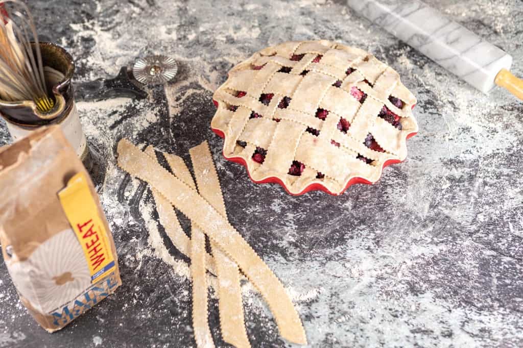 Bumbleberry pie topped with a lattice crust.